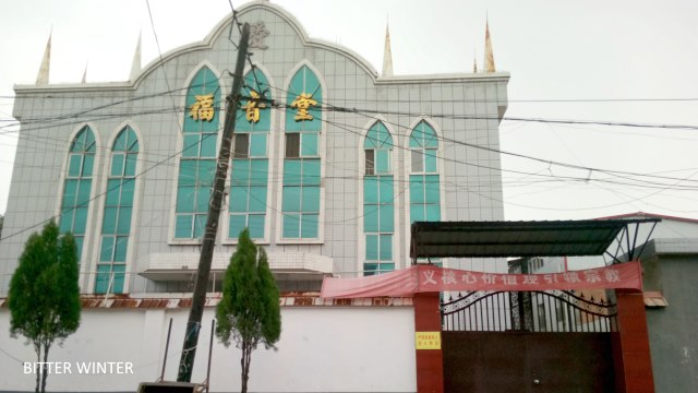 The cross is removed from a church in Xiguan village.