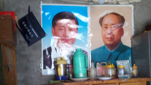Portraits of Mao Zedong and Xi Jinping were put up instead of religious drawings.