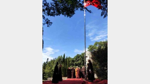 Monks at Wanshan Temple in Jiangxi’s Lushan city attend a flag-raising ceremony.