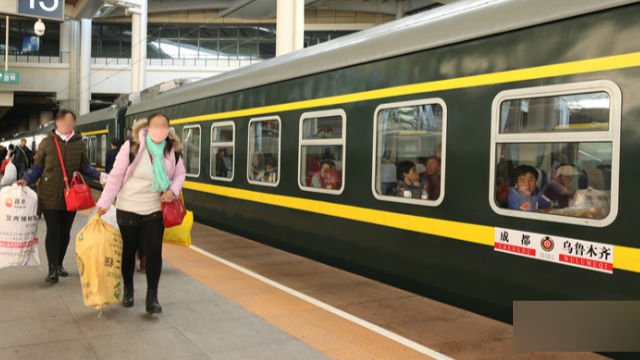 two uyghur women boarding the train
