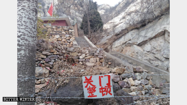 The road to Taizi Temple is blocked by barbed wire