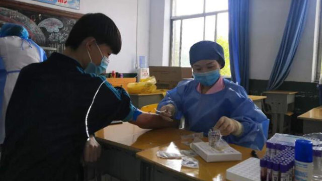 In May, a public health center in Shiheng, a town in Shandong’s Feicheng city, collected blood samples from all teachers and students returning to the town’s middle school.