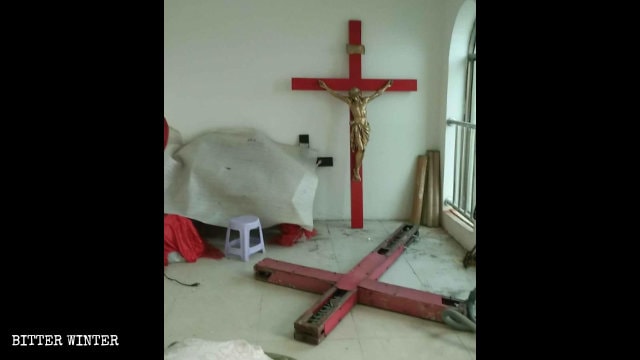 The removed crosses from the Xingdi village church were piled up in a corner.