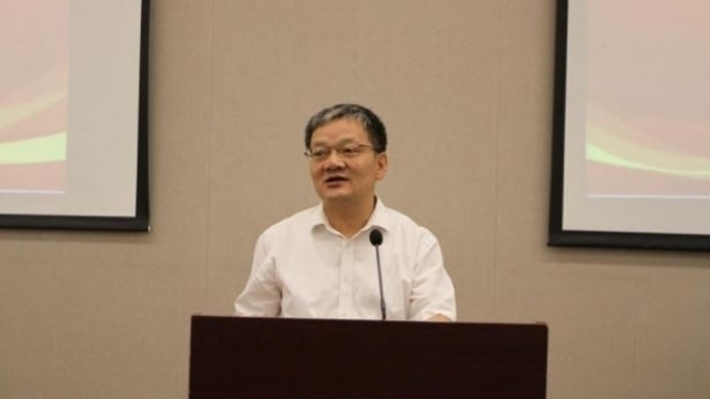 Fan Jianxin, Chairman of the Chinese Atheism Society, speaks at the forum.