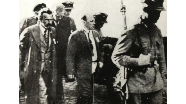 Bukharin (the bald man in the center) and co-defendants led to the trial where they will be sentenced to death in 1938.