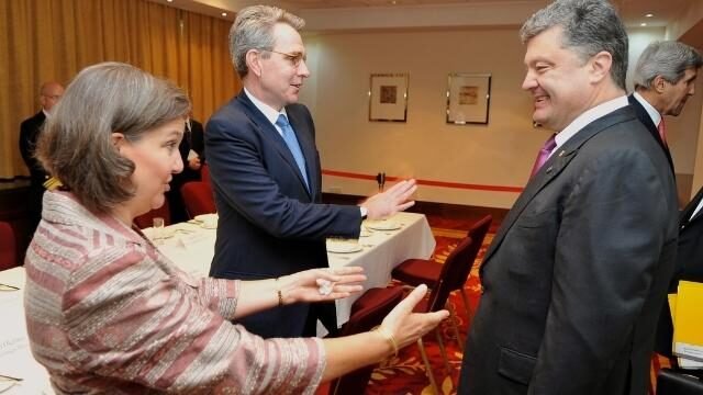 Nuland and Ambassador Pyatt (left) congratulate President-elect Poroshenko (right) in Warsaw, 2014.