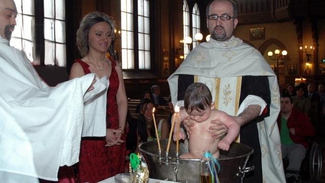 Infant baptism in a Greek Orthodox Church. Jehovah’s Witnesses reject this practice as non-Biblical.