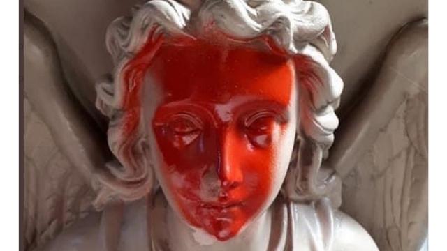 The angel’s face painted in red in St. Vincent’s. From Twitter.