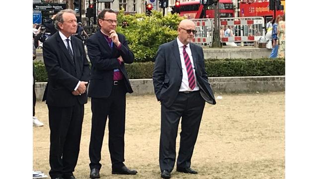 Left to right, David Alton, the Bishop of Truro, the Right Revd. Philip Mounstephen, and Mervin Thomas, of Christian Solidarity Worldwide, during the Parliament Square vigil held in connection with the Ministerial to commemorate the Urumqi massacre of Uyghurs, 13 years ago.