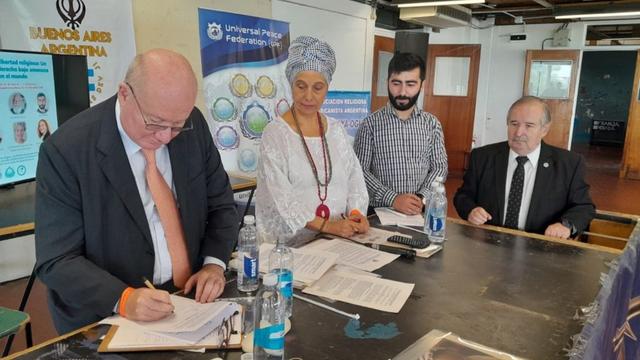 Signing a declaration for religious liberty at the end of the panel discussion.