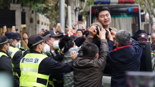 Shanghai police in action against protesters. From Twitter.