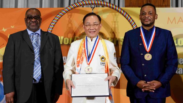 Dr. Hong (center) is presented with the U.S. President’s Lifetime Achievement Award in New York, March 31, 2023. Source: AP Images, reprinted with permission.