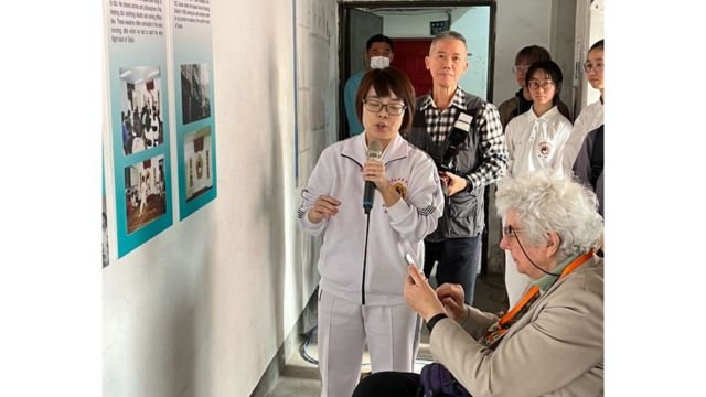 Eileen Barker visiting the historical exhibition in the old Lainan Street Academy site.