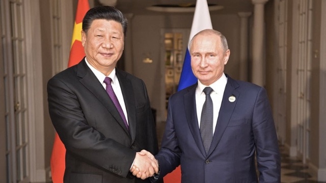 Putin and Xi Jinping. Credits.