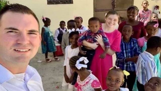 The Lloyds with Haitian children. From X.