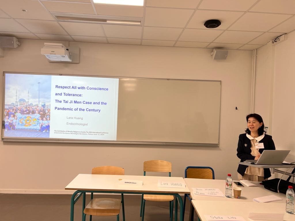 Lara Huang presents her paper.