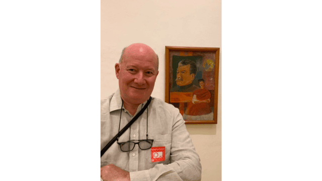Massimo Introvigne in Rivera and Kahlo&rsquo;s Mexico City home, in front of Frida&rsquo;s homage to Stalin (1878&ndash;1953).