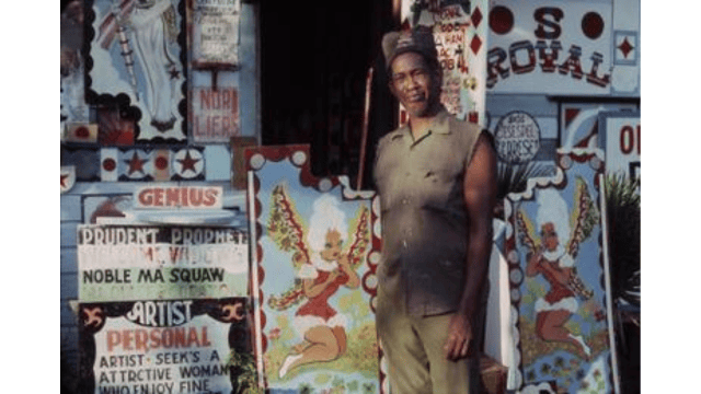 Royal Robertson in front of his home. Credits.