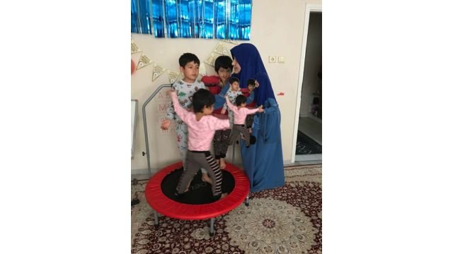 Idris Hasan’s family making the best of things as they wait for news of their father. Front Uyghuray, left Abdulkerim, and right Nefise with mother Zeynure. Photo by Ruth Ingram.