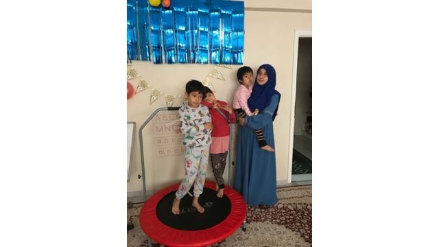 Another image of the family. Left to right Abdulkerim, Nefise, Uyghuray, and Zeynure. Photo by Ruth Ingram.