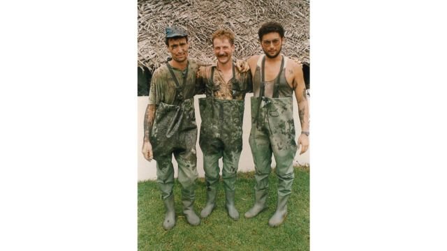 Paul Henry, Robin Dunn, and Roland Gianstefani stand on the open sewer, 1992.