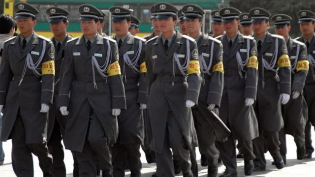 Security officers in Beijing. Credits.