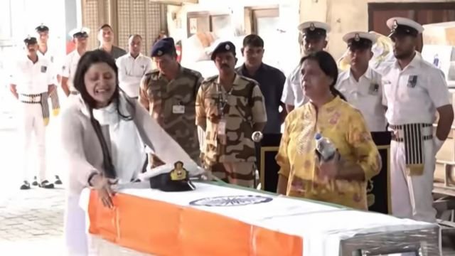 The widow of Vynai Narwal with her husband’s coffin. She reported he was shot “for not being a Muslim.” Screenshot.