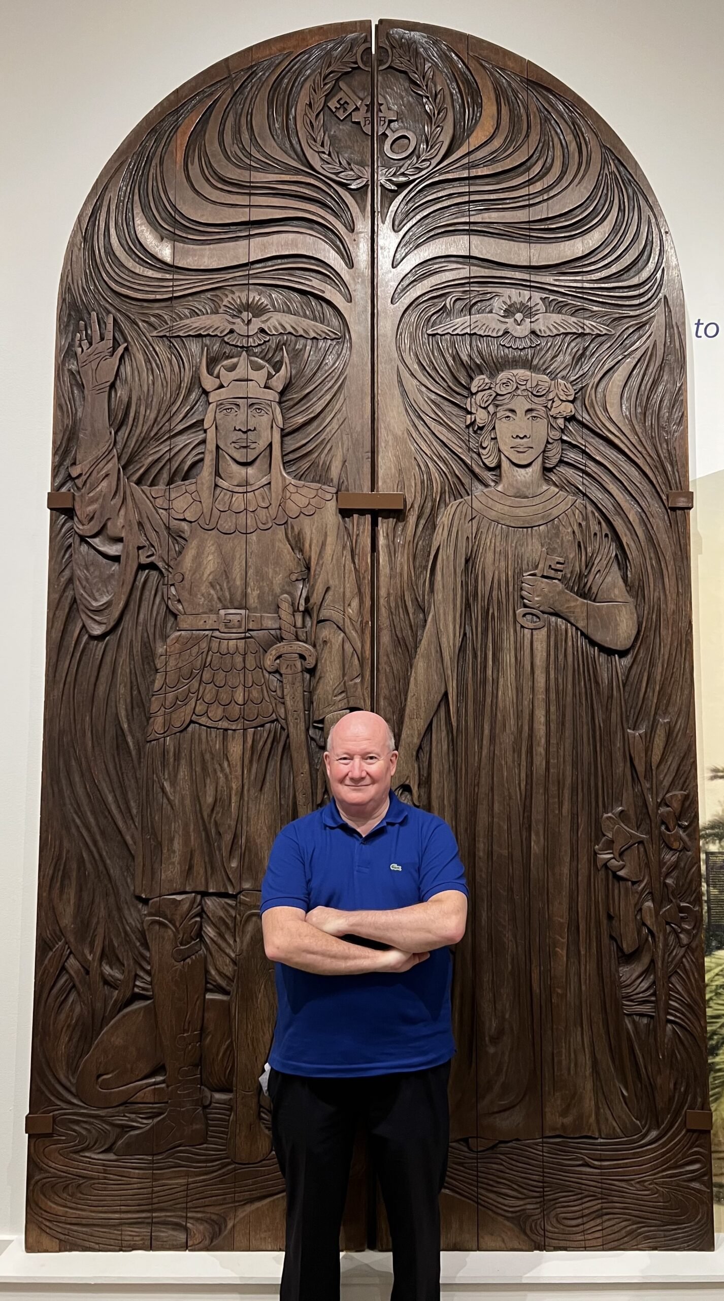 Massimo Introvigne in front of one of Machell’s temple doors, exhibited in San Diego in 2022.