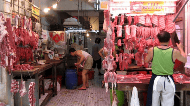 Meat market stall in Hong Kong. Credits.