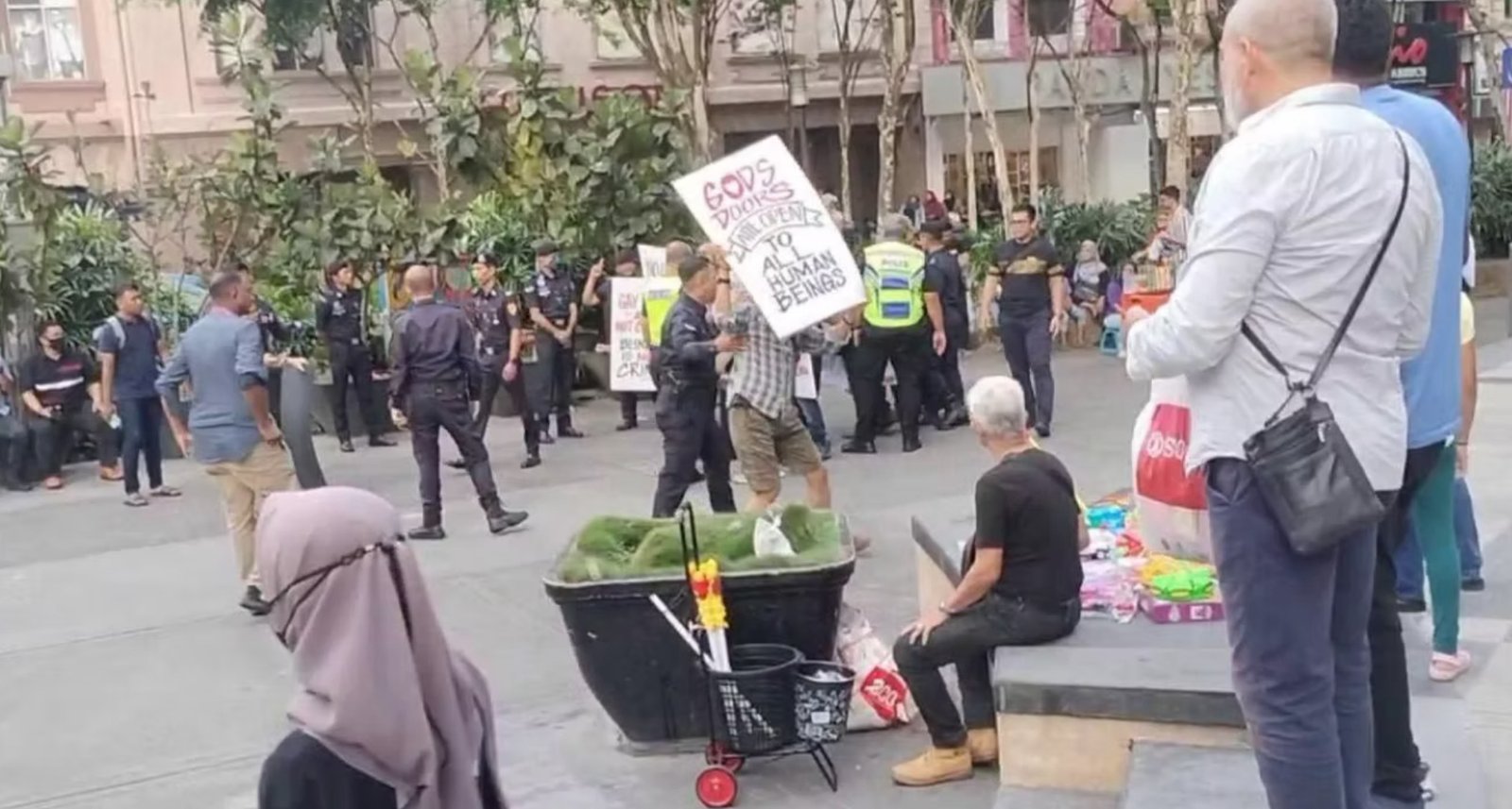 Police arrest AROPL believers expressing their support to the LGBTQ community in Kuala Lumpur, Malaysia, July 29, 2023.