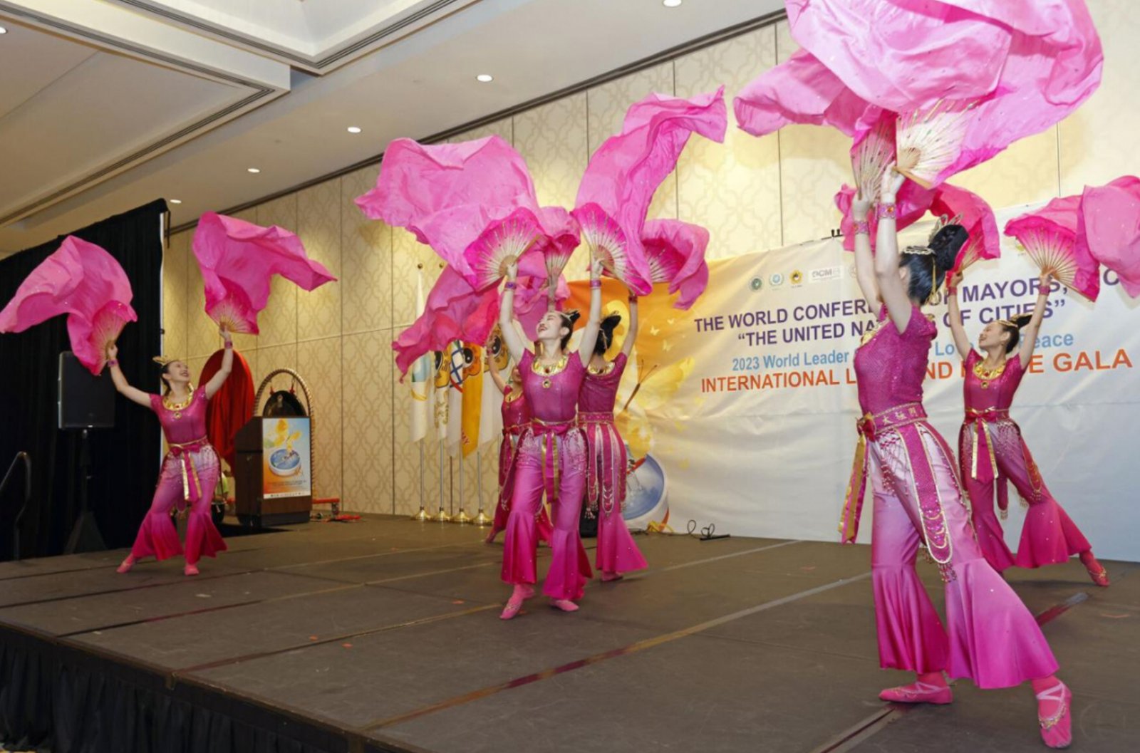 Tai Ji Men members present the Purple Phoenix dance during the World Conference of Mayors in New Orleans on August 4, 2023. Photo by Tyler Kaufman. Courtesy of Tai Ji Men Qigong Academy.

