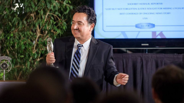 The author speaking as a Radio Free Asia reporter at the New York Festival, New York, in 2013.