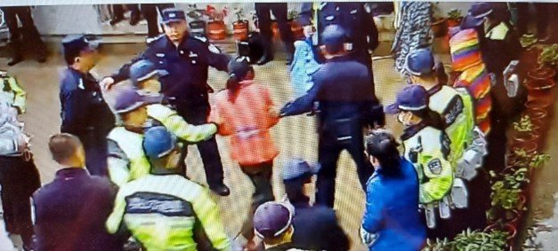 An image of the raids on the Life Zen Temple.