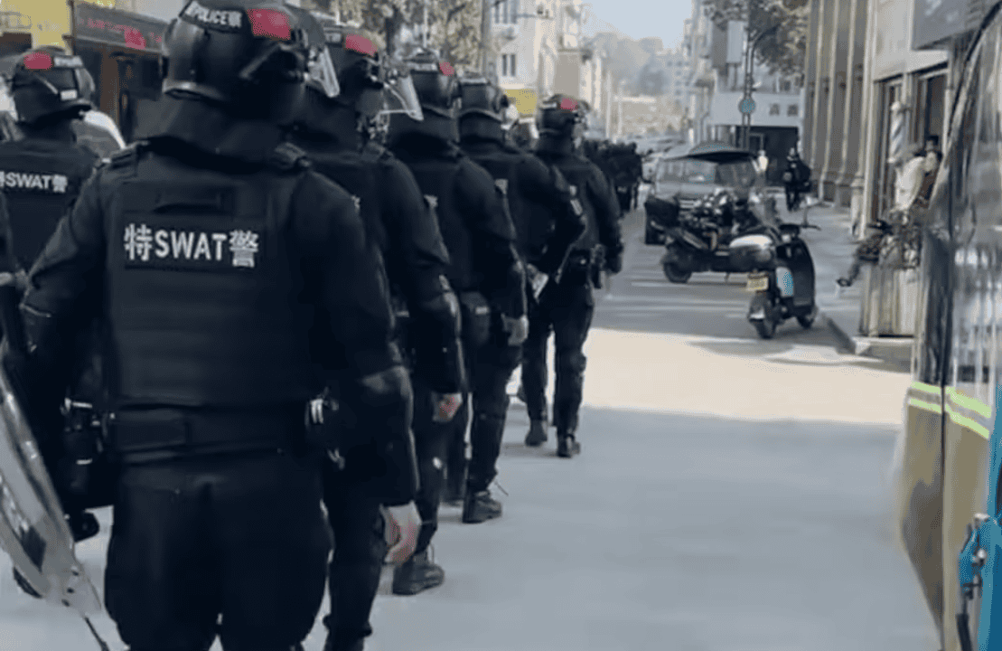 Police entering Yay&aacute;ng Town on 13 December. Photo by local Christians.