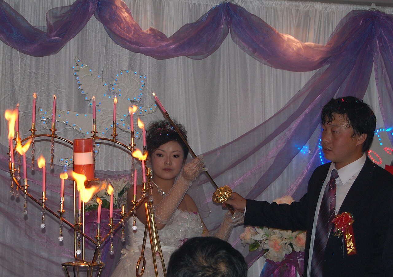 Newlyweds celebrate in China. Credits.