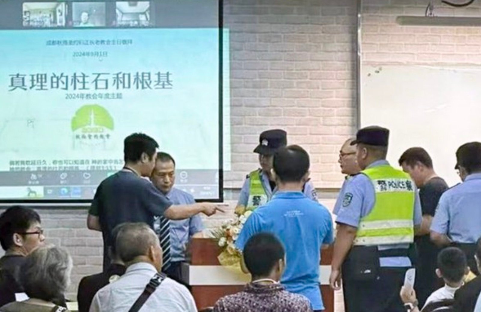 Police raiding a gathering of Early Rain believers. From X.