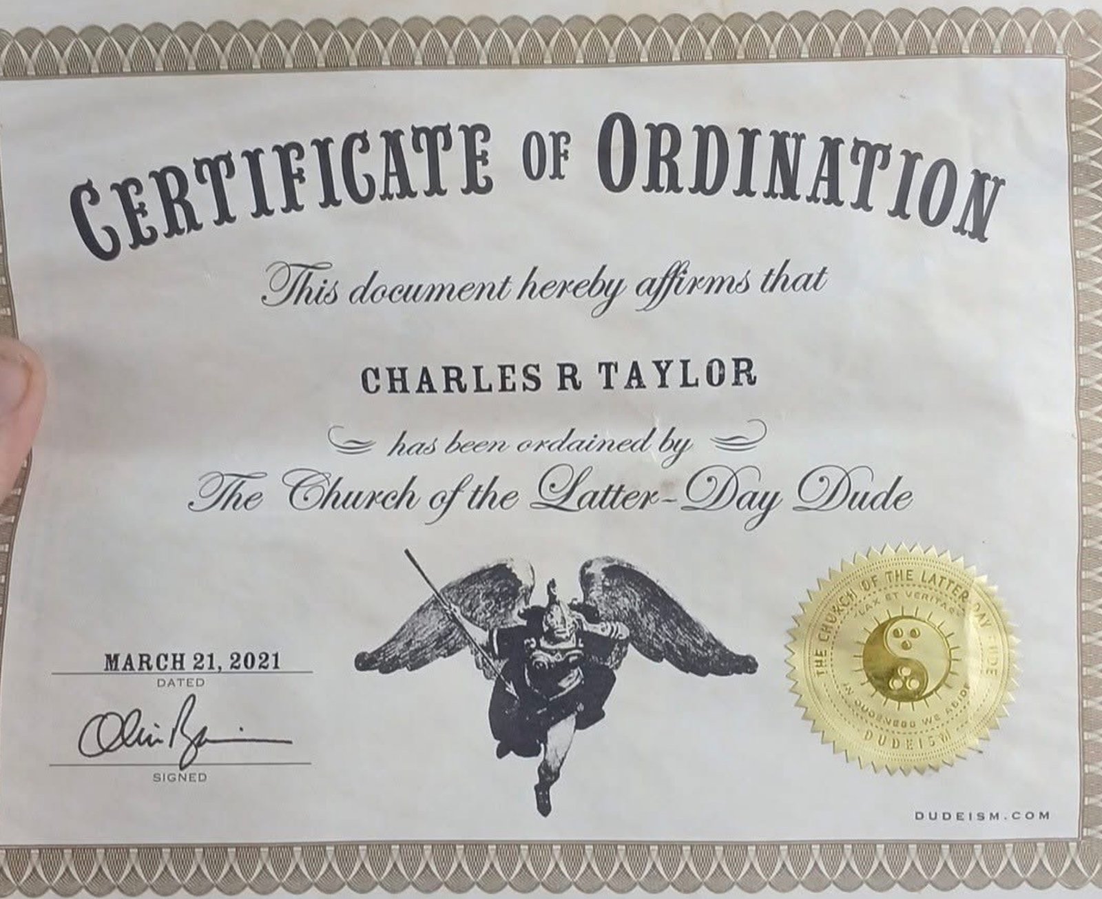 Certificate of ordination as a minister in the Dudeist religion. Social media.