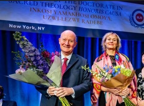  Massimo Introvigne and Rosita Šorytė receive flowers after the American launch of their book “The Revelation Spiritual Home.”