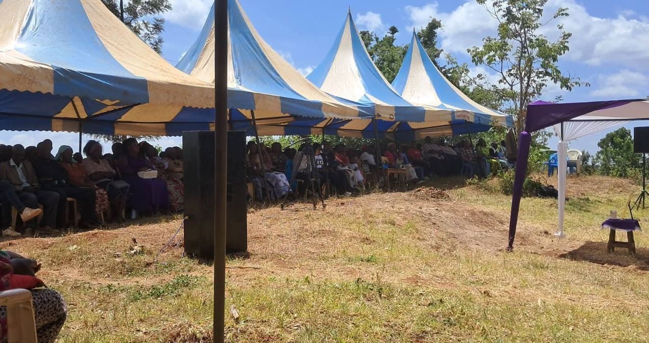 The symbolic funeral of Charles Waithaka Wangari, with a lonely candle replacing his body. From Facebook.