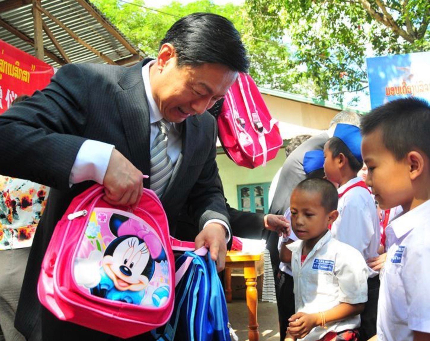State-controlled charity. Guo Weimin, Vice Minister of the State Council Information Office of China, brings gifts collected in China to Laos. Source: State Council Information Office of China.