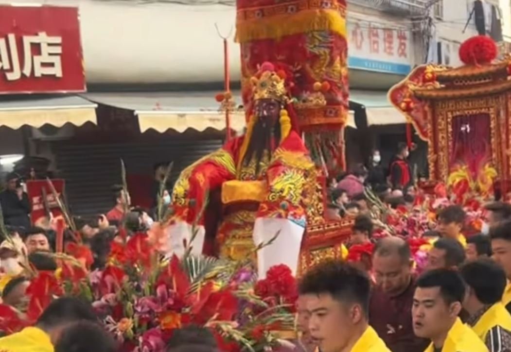 The City God is carried through the streets.