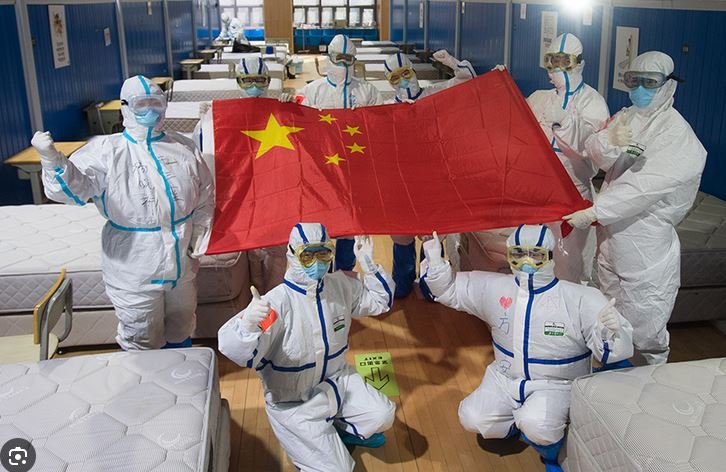 Doctors and paramedics celebrating &ldquo;victory&rdquo; over COVID. From Weibo.