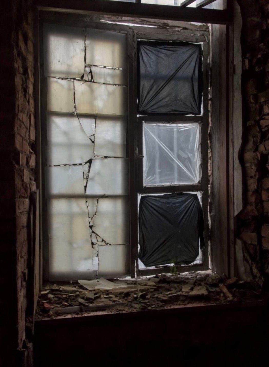 The prison&rsquo;s windows: blocking the sunlight but not the cold.