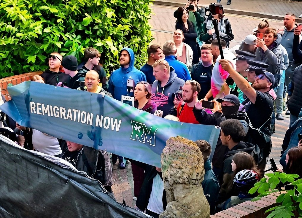 Rioters at Webb House in May. Note the &ldquo;remigration&rdquo; flag. &nbsp;