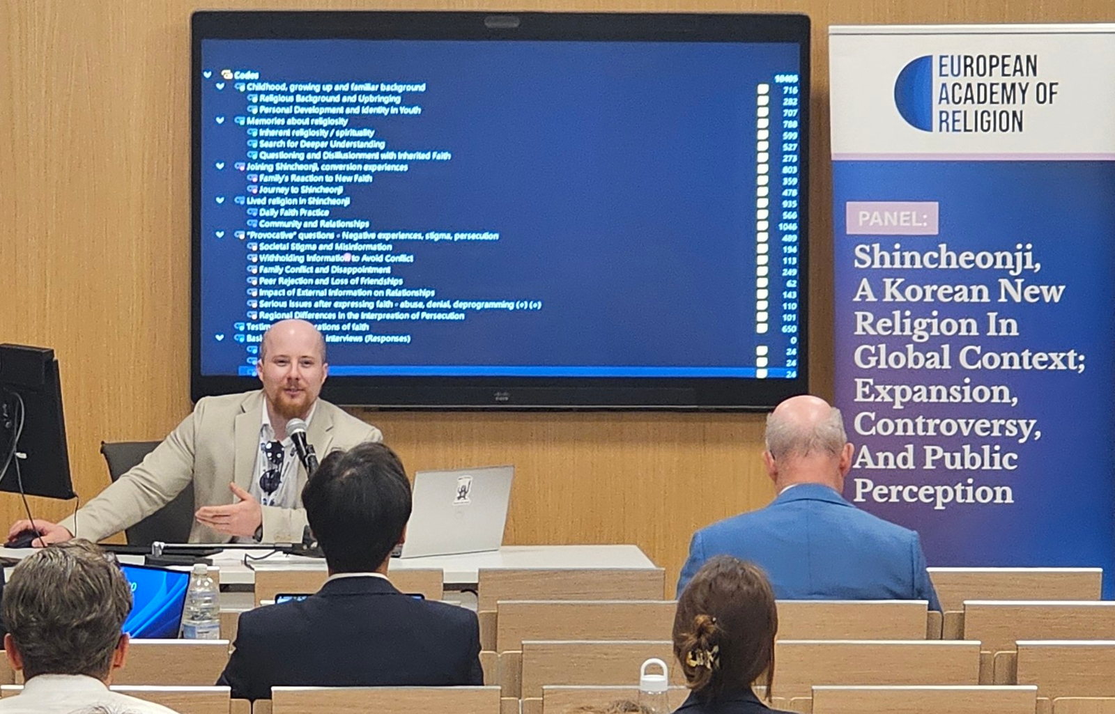 Márk Nemes presenting his research in Rome.