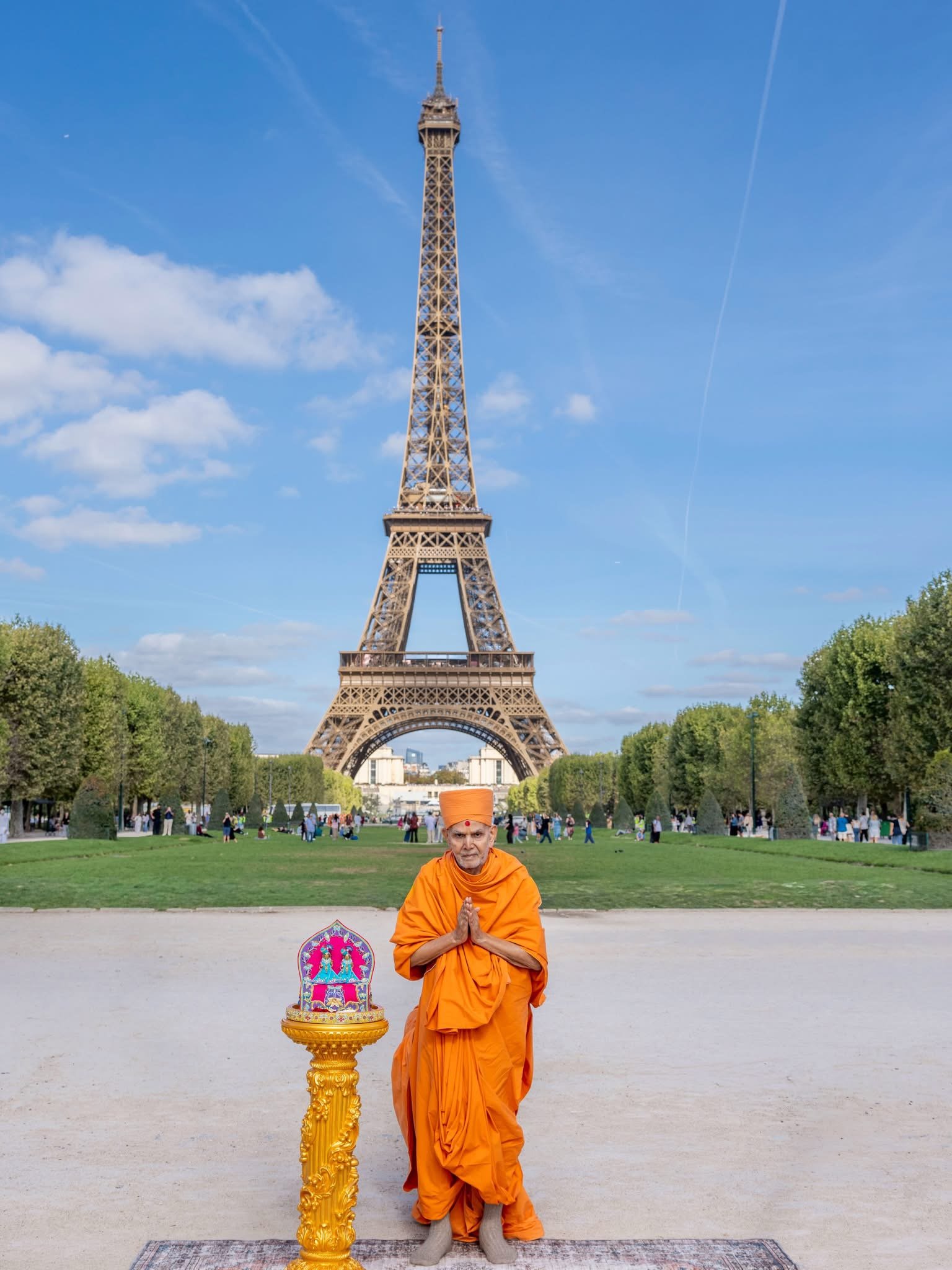 BAPS leader Mahant Swami Maharaj blessing the city of Paris in front of the Eiffel Tower. Social media.